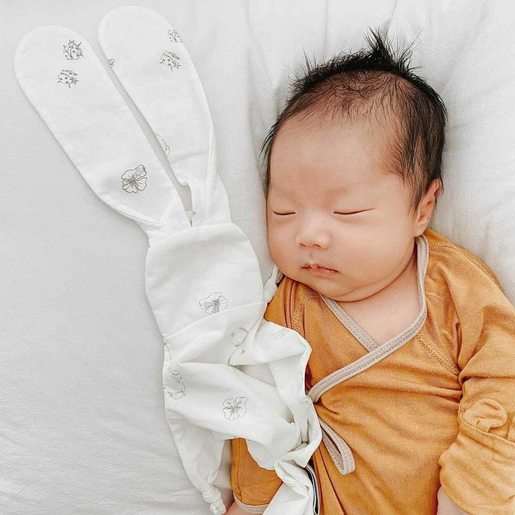 Baby sleeping best sale with lovey